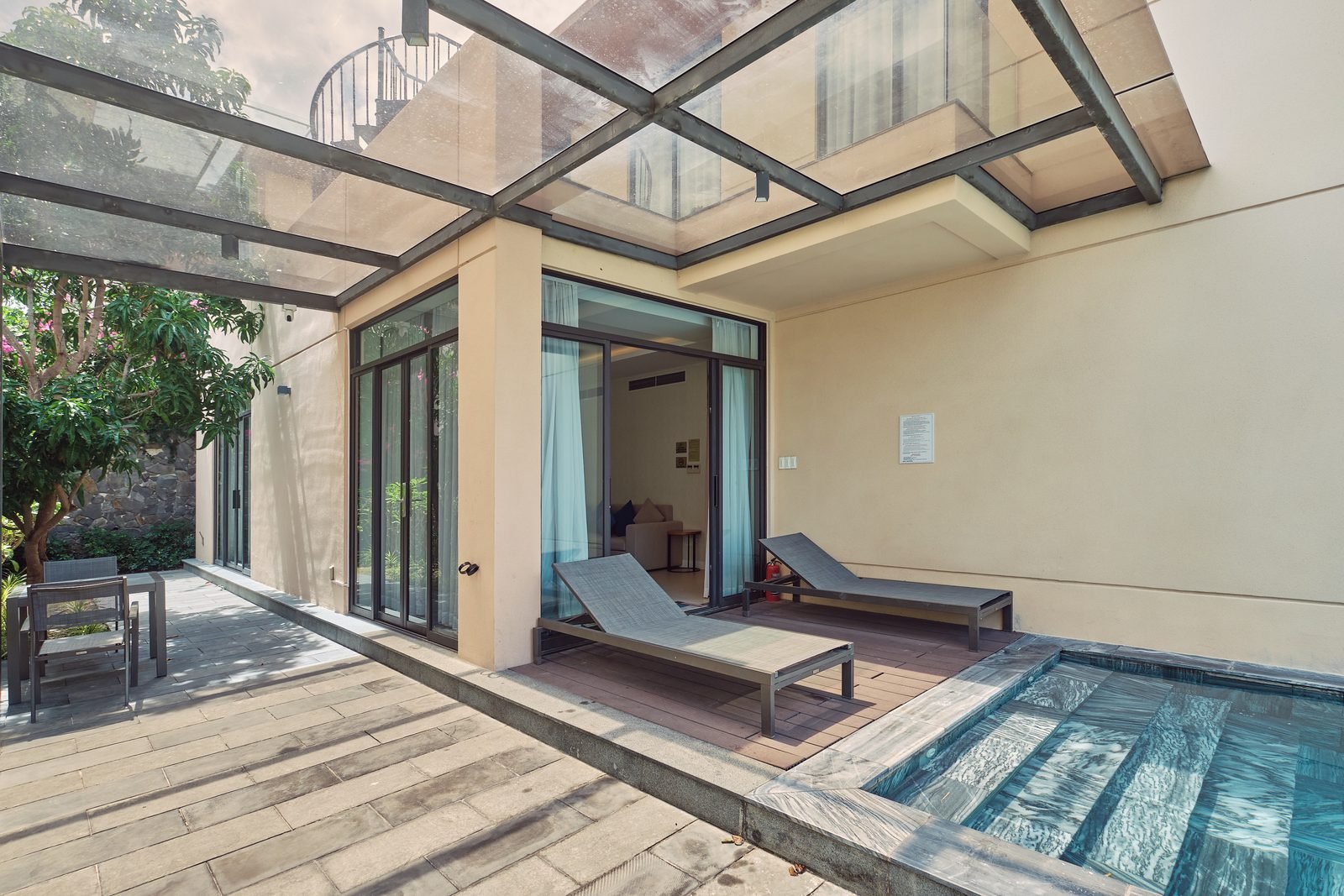 Courtyard pool and sun deck of the Deluxe Pool Villa